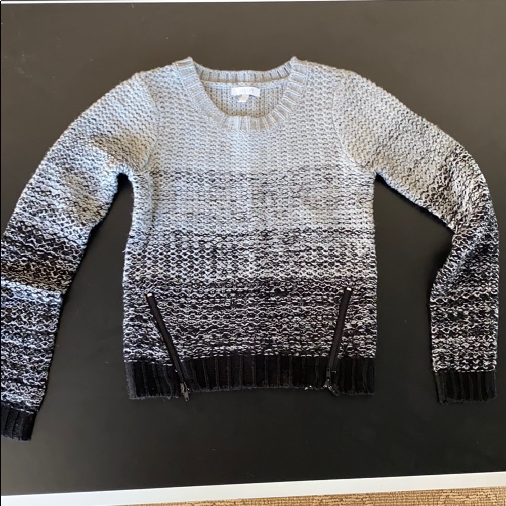 gray/black sweater with decorative zippers